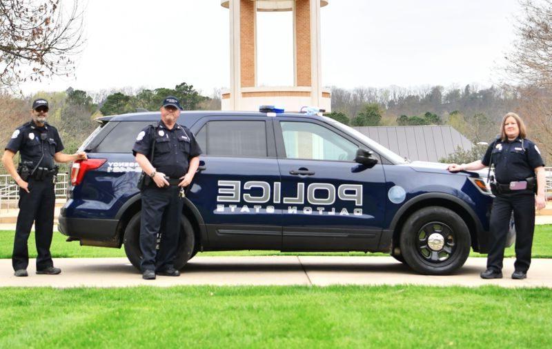 Dalton State Campus Police posing next to official police vehicle